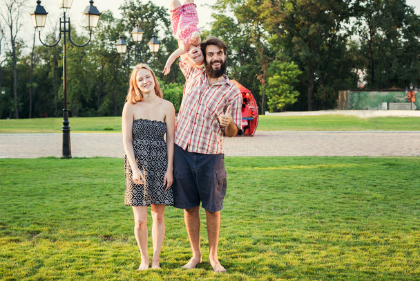 young happy family having fun outdoors in park - Foto, Imagem