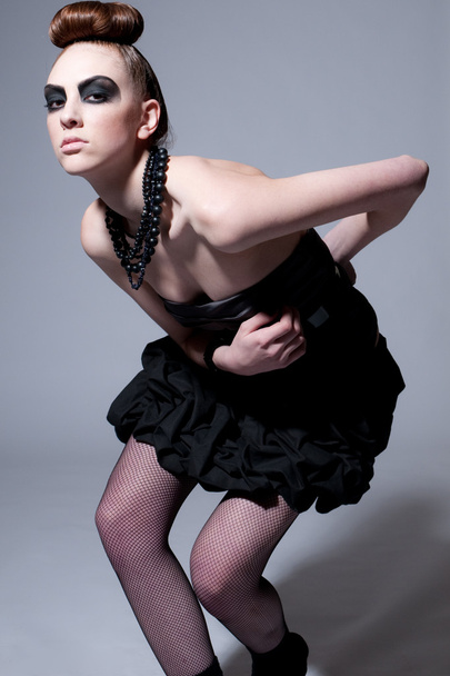 Beautiful fashion model with black make-up - Фото, изображение