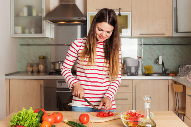 Young Woman Cooking Vegetable Salad.  Dieting Concept. Healthy f - Fotografie, Obrázek
