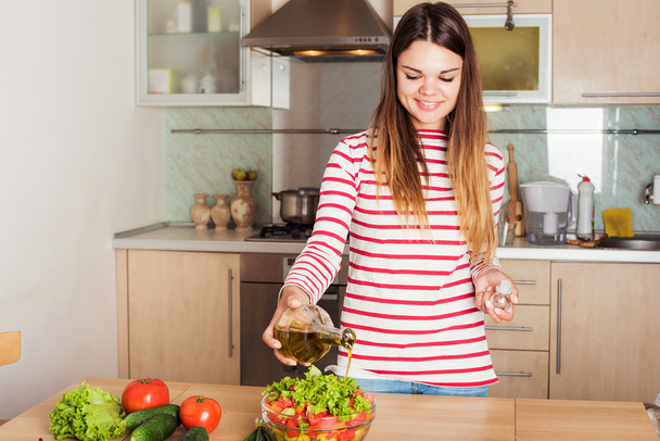 Young Woman Cooking Vegetable Salad.  Dieting Concept. - Fotó, kép