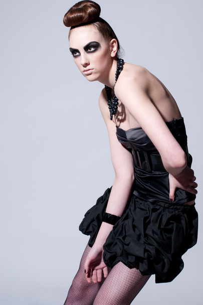 Beautiful fashion model with black make-up - Φωτογραφία, εικόνα