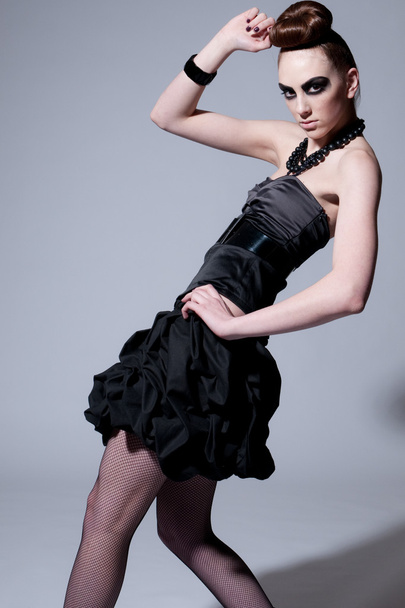 Beautiful fashion model with black make-up - Foto, imagen