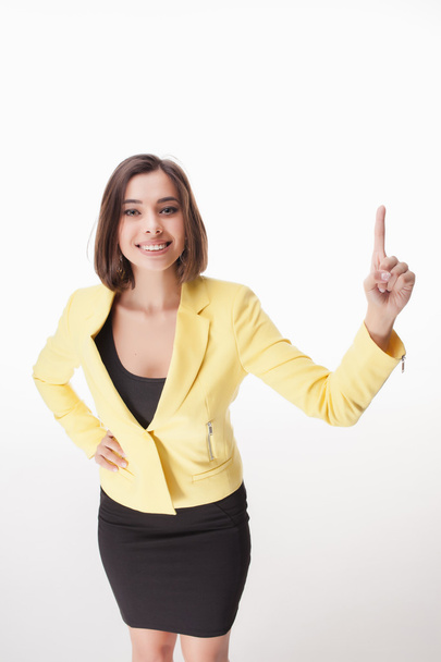 young business woman showing something on the white background - Foto, imagen