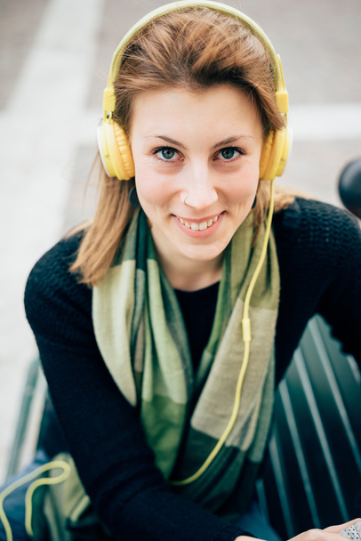 Hipster woman listening music with headphones - 写真・画像