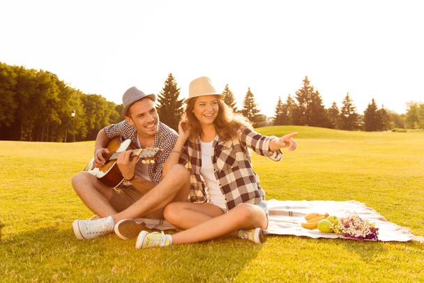 happy couple in love at a picnic - Фото, изображение