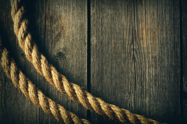 Rope over wooden background - Foto, imagen