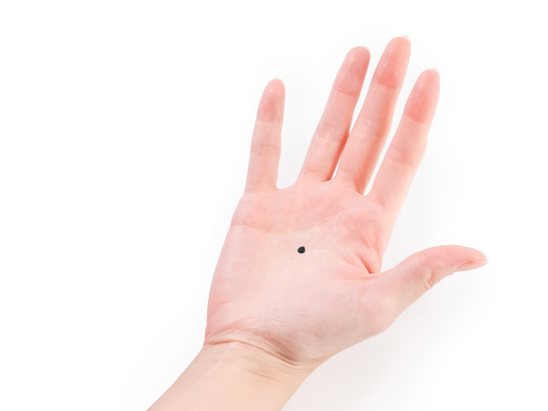woman hand with black dot - Foto, Imagem