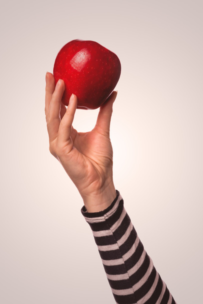 Woman holding organic red delicious apple - Фото, зображення