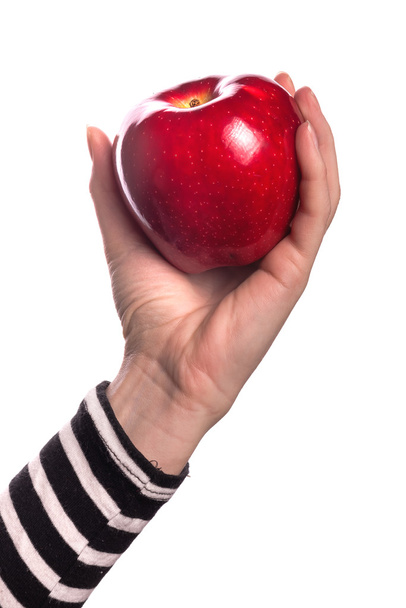 Woman holding organic red delicious apple - Фото, зображення