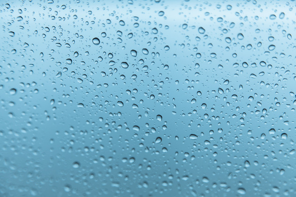 krople deszczu na szklanym tle - Zdjęcie, obraz
