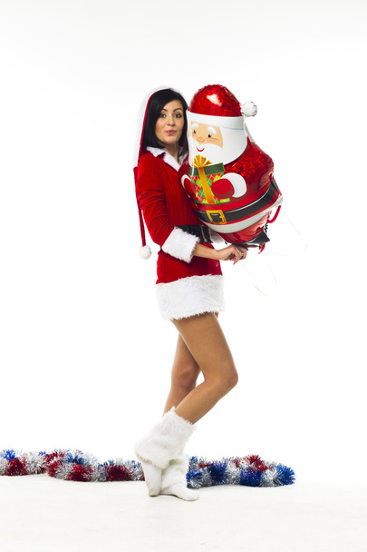 Beautiful young woman dressed as Santa Claus on a white backgrou - Foto, imagen