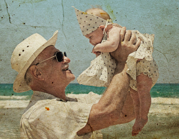 Felice nonno sta tenendo in braccio una nipotina
. - Foto, immagini