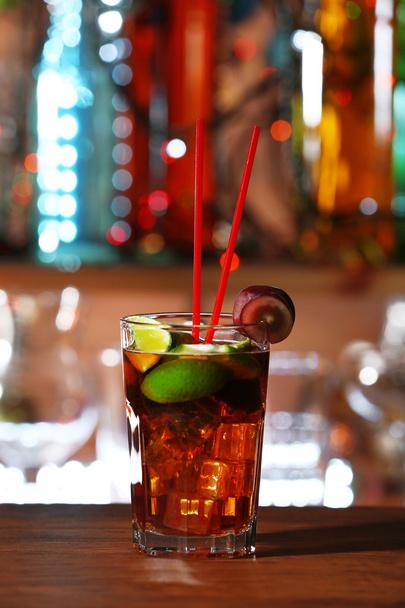 Glass of cocktail on the bar counter - Valokuva, kuva