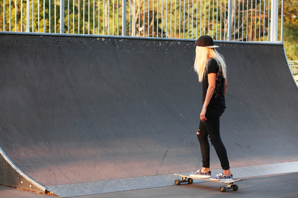 Young woman with skating board - Photo, image