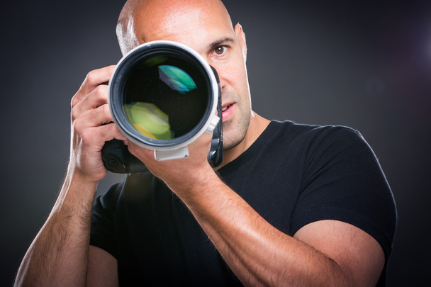 Male photographer  during a photo shoot - Fotó, kép