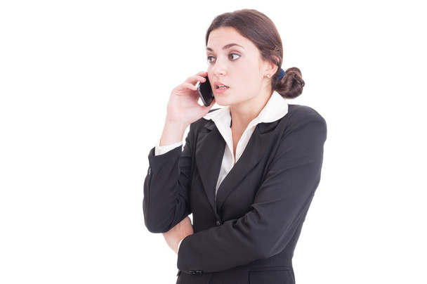 Surprised young business woman having a phone conversation - Photo, Image