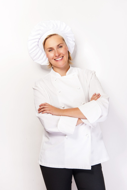 Femme chef en tenue de cuisine sur fond blanc souriant avec cro
 - Photo, image