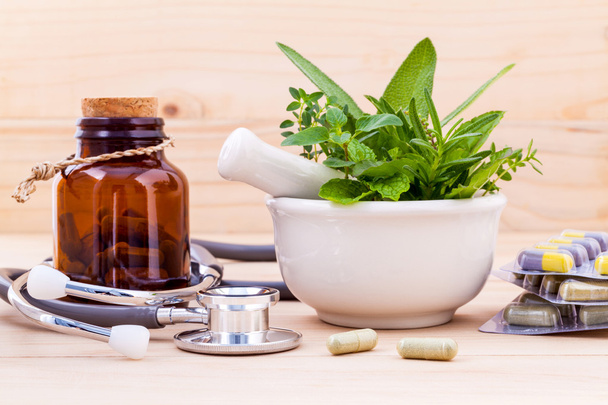 Capsule of herbal medicine alternative healthy care with stethos - Φωτογραφία, εικόνα