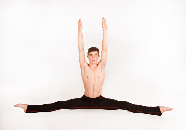 slender man doing gymnastic exercises - Fotó, kép