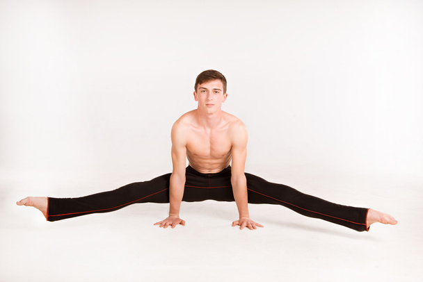slender man doing gymnastic exercises - Photo, Image