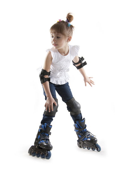 The little girl on roller skates - Foto, immagini