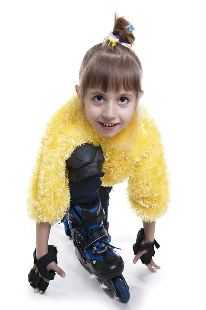 The little girl on roller skates - Zdjęcie, obraz