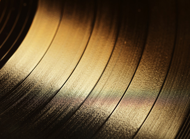 Segment de disque vinyle avec étiquette montrant la texture des rainures
 - Photo, image