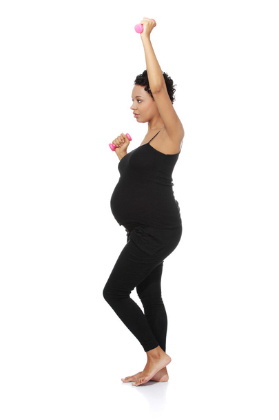 Pregnant woman during exercising. - Fotografie, Obrázek