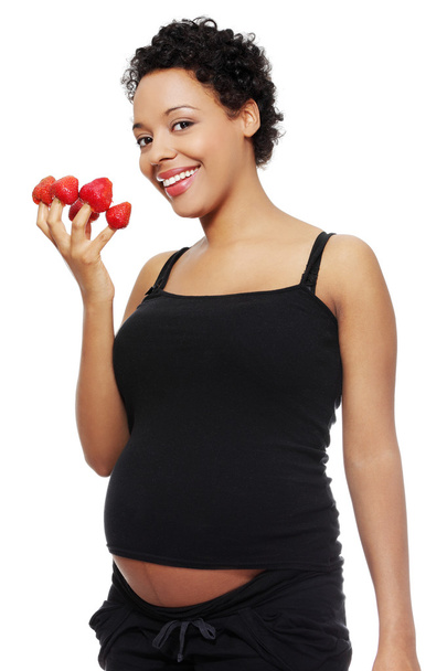 Pregnant woman eating healthy food. - Фото, изображение