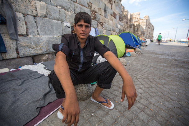 Unidentified refugee near tents - Photo, Image