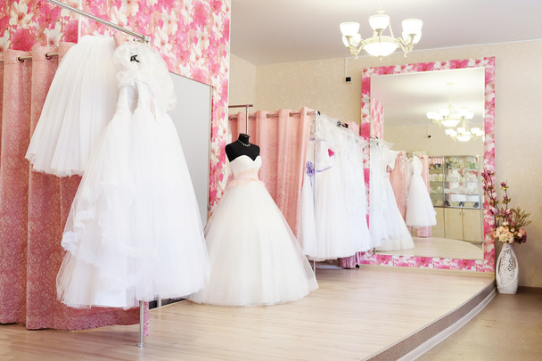 Wedding dresses in a show-room - Фото, зображення