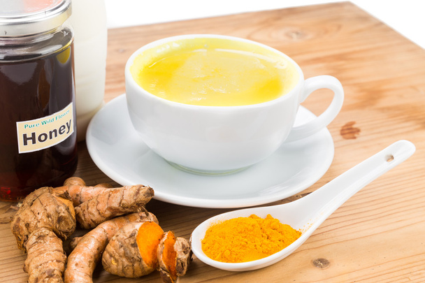 Turmeric roots with milk and honey drinks for beauty and health. - Photo, Image