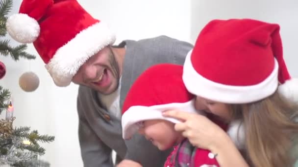 family dressed in santa hats - Video
