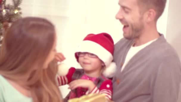 family near the Christmas tree - Felvétel, videó