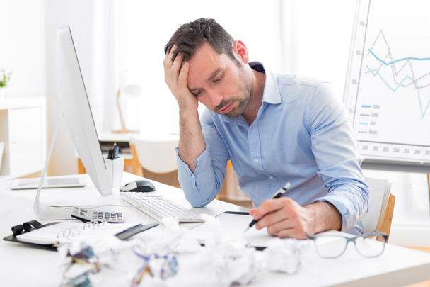Young attractive man too tired to work - Foto, Bild