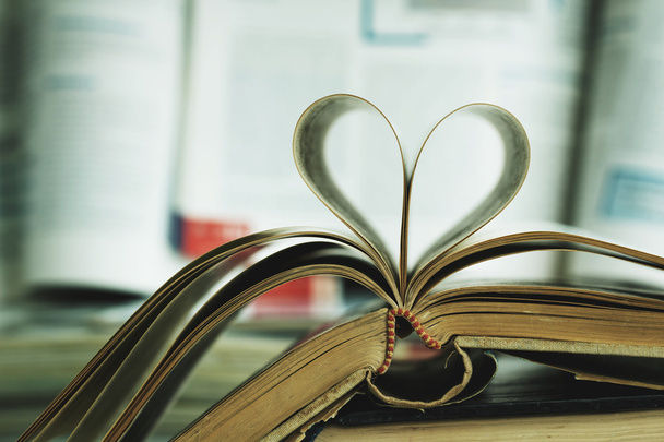 Vintage of book pages, heart shaped - Photo, Image