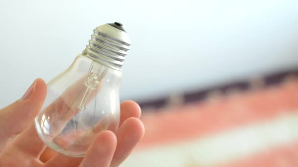 man holds bulb in the hand - detail - Footage, Video