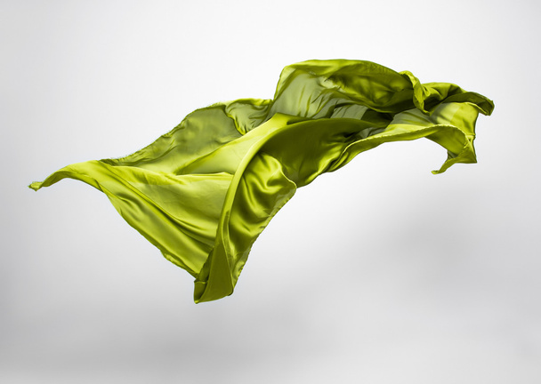 abstract piece of green fabric flying - Fotoğraf, Görsel
