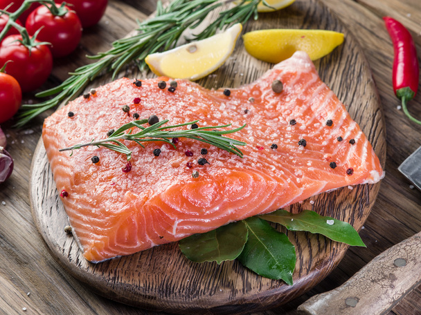 Fresh salmon on the cutting board. - Фото, зображення