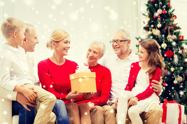 smiling family with gifts at home - Foto, Bild