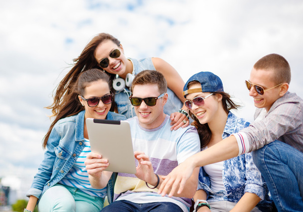 group of smiling teenagers looking at tablet pc - Fotoğraf, Görsel