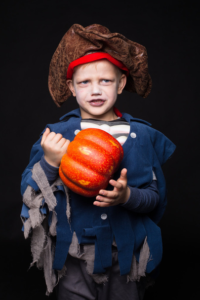 Little boy wearing pirate costume. Halloween. Studio portrait over black background - Foto, imagen