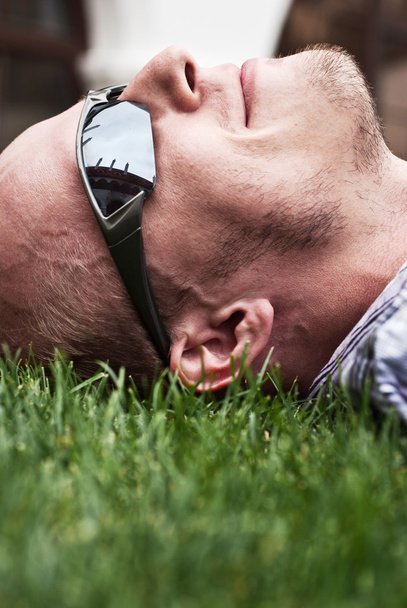 Man lying on the grass - Photo, Image