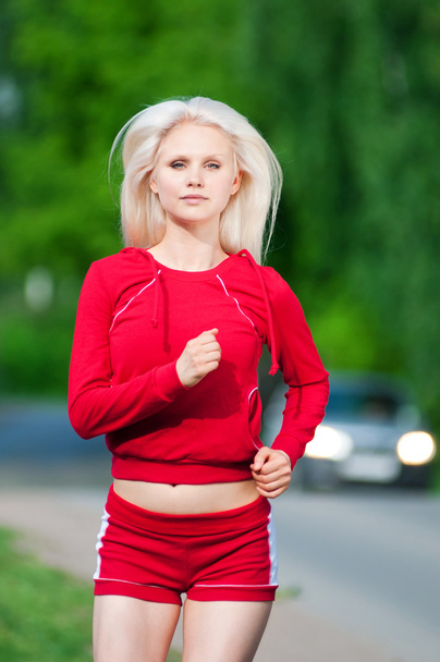 Beautiful woman running in park - Zdjęcie, obraz