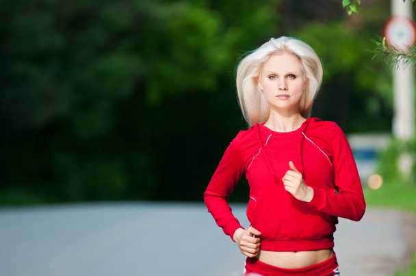 Beautiful woman running in park - Valokuva, kuva