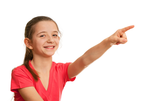 Smiling girl pointing forward - Photo, image