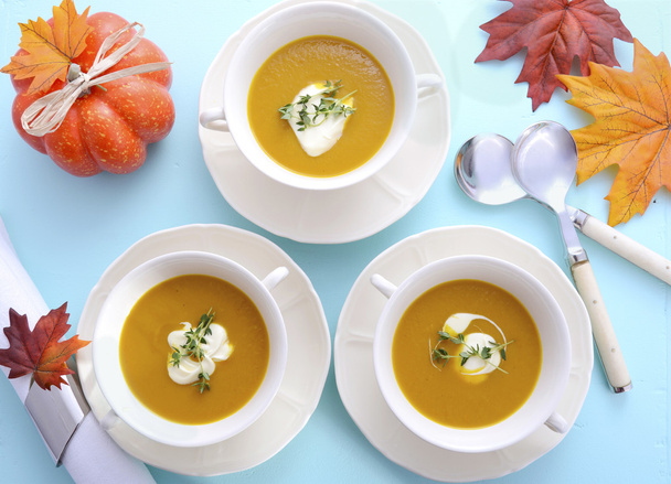 Thanksgiving table setting with pumpkin soup. - 写真・画像