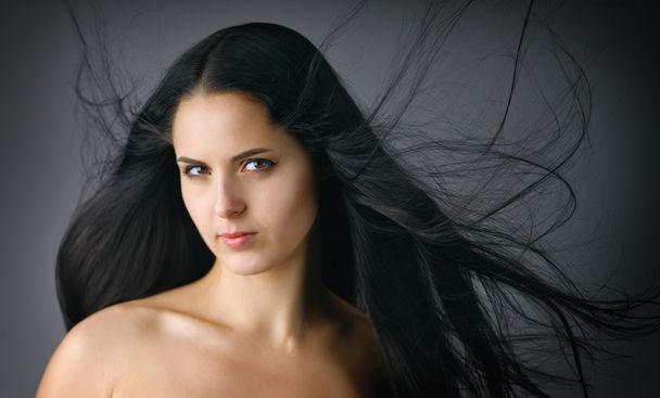 Beautiful woman with long black hair. - Foto, Bild