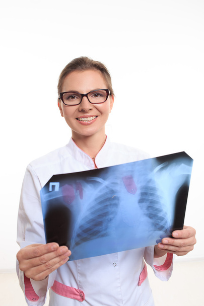 woman doctor holding an x-ray edges - Фото, изображение