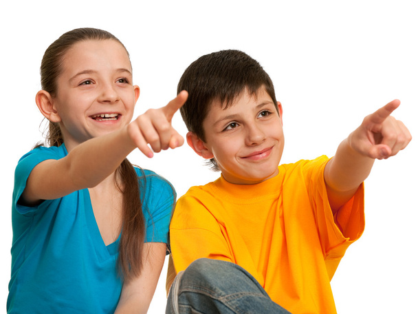 Smiling children pointing forward - Foto, immagini